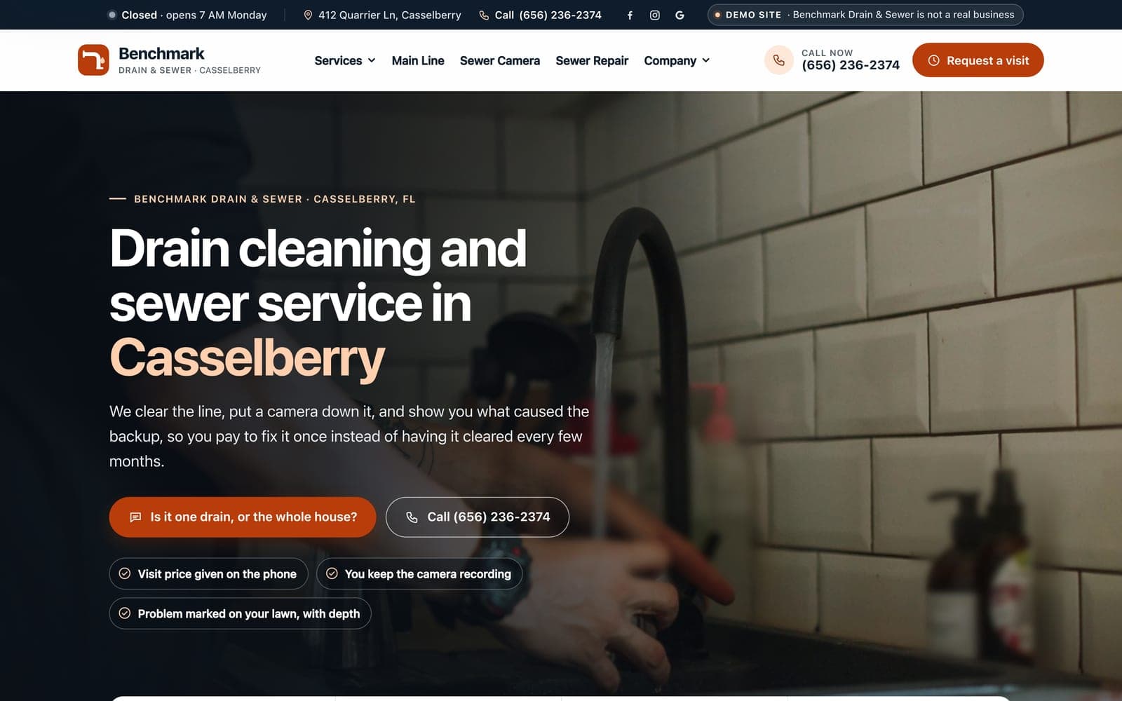 A drain and sewer company's home page we built, on a laptop