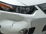 Damage to the front corner of a car, an example of a photo a customer sends