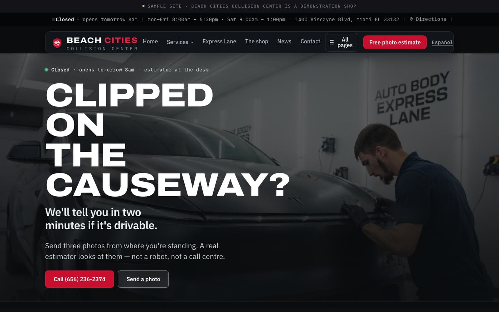 The auto body site we built, open on a laptop