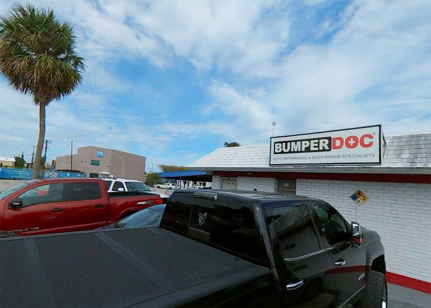 BumperDoc Oakland Park, a real location The BumperDoc sign on a white brick shop in Oakland Park, Florida