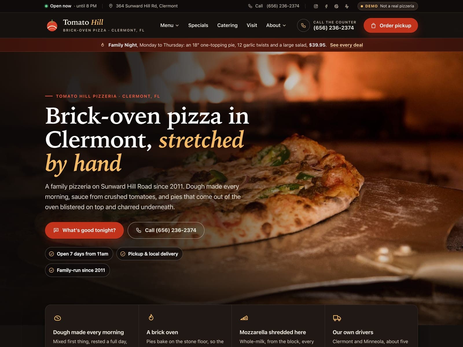 Tomato Hill Pizzeria, a sample website, on a laptop
