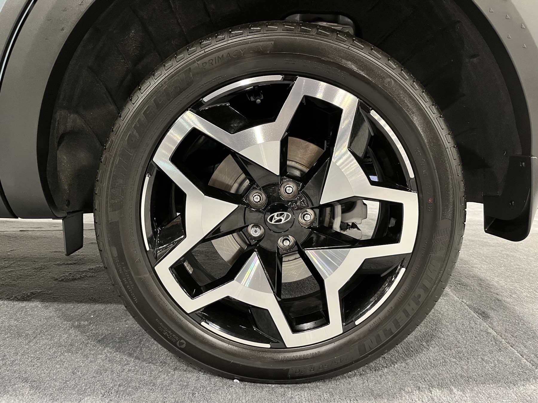 A new vehicle on display under showroom lighting