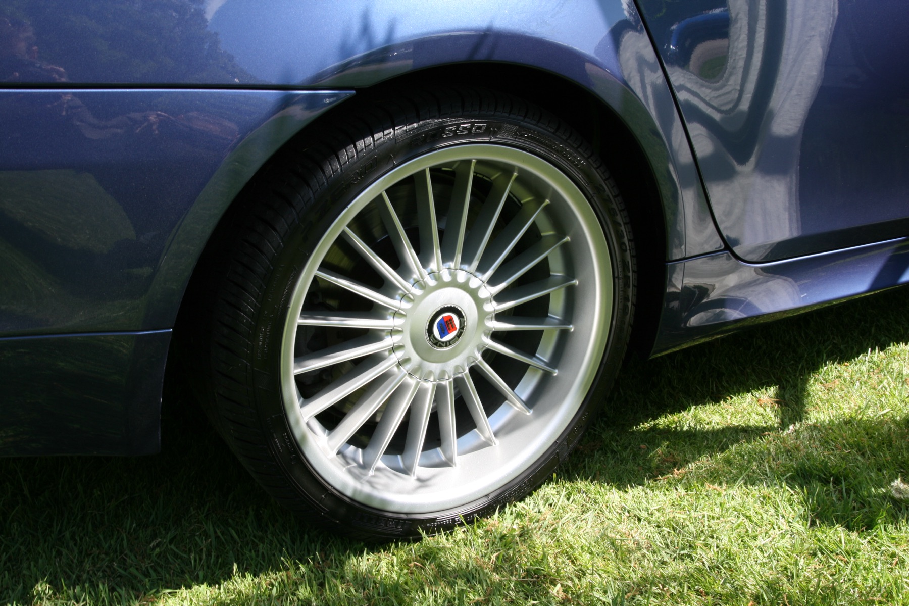 A clean multi-spoke alloy wheel on a car