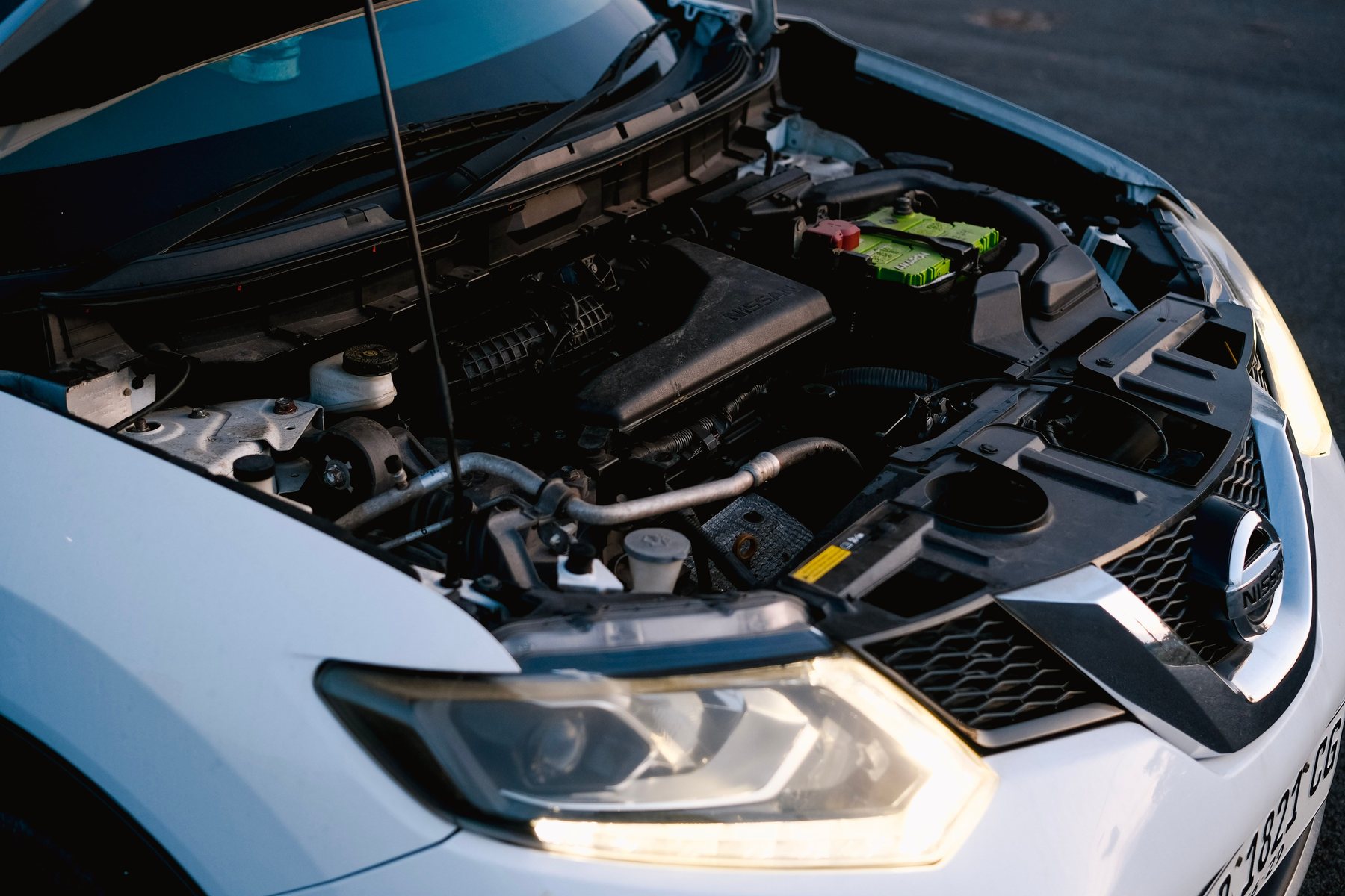 Checking a car battery under the bonnet