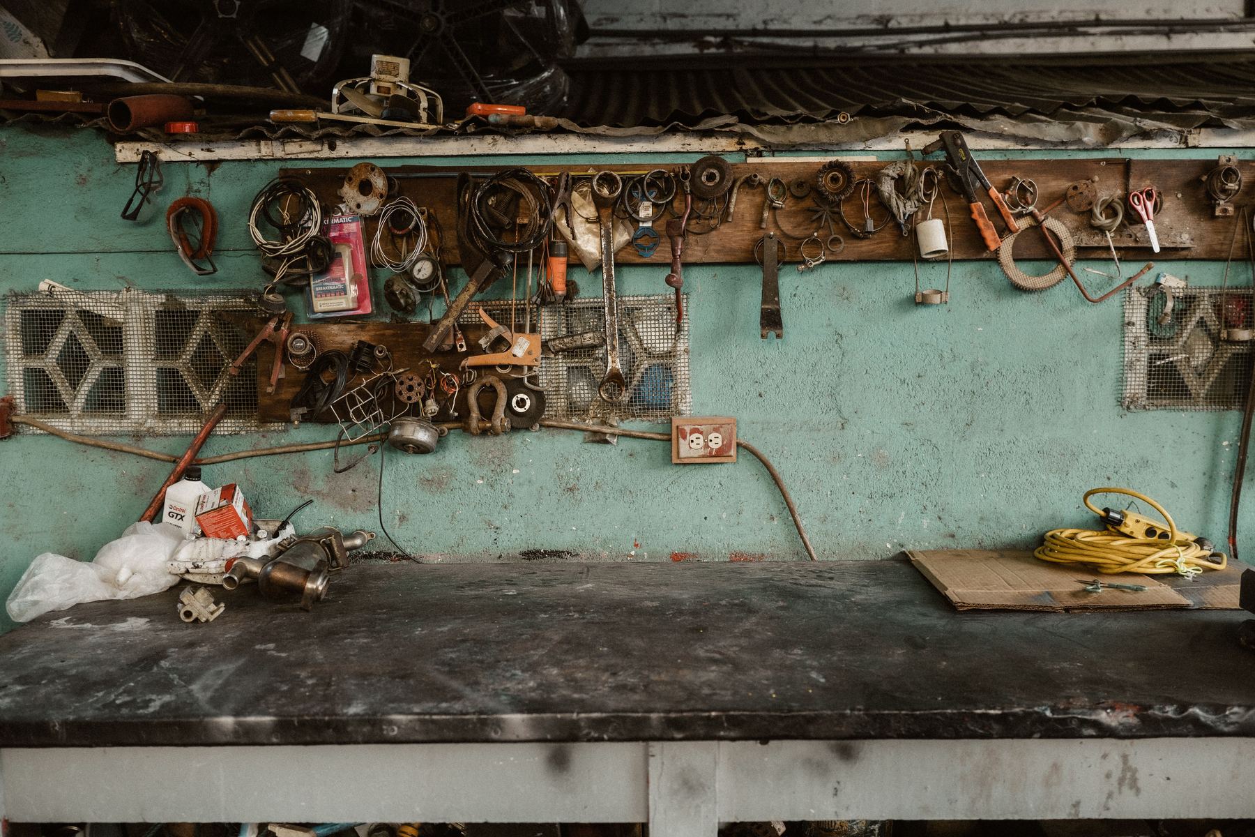 Tools and parts laid out on a workbench