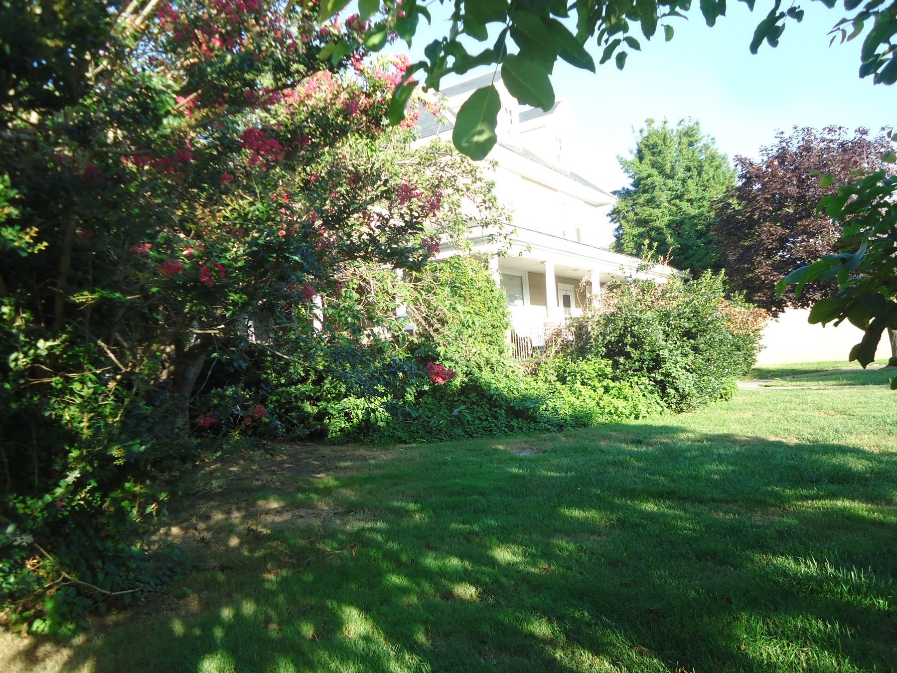 A house set back on a wide lawn