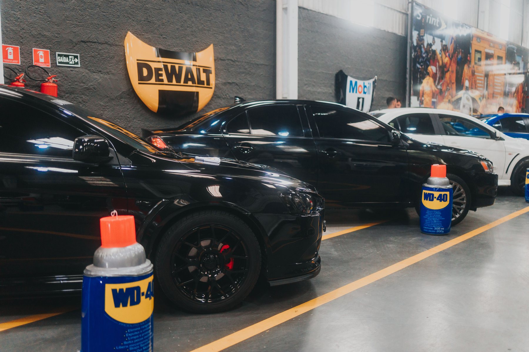 The forecourt of a car workshop with vehicles waiting