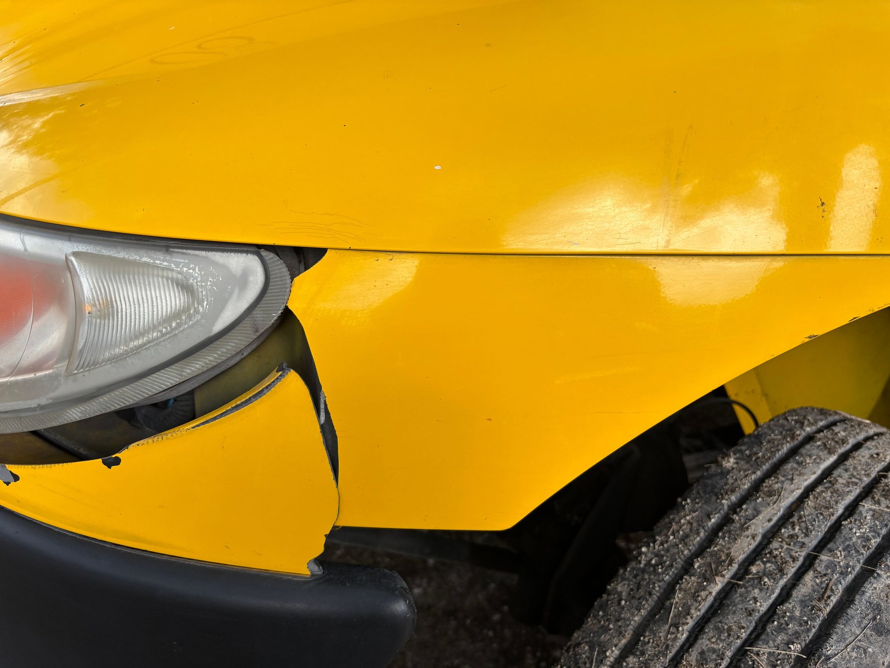 A long scratch keyed into the paint along a car door