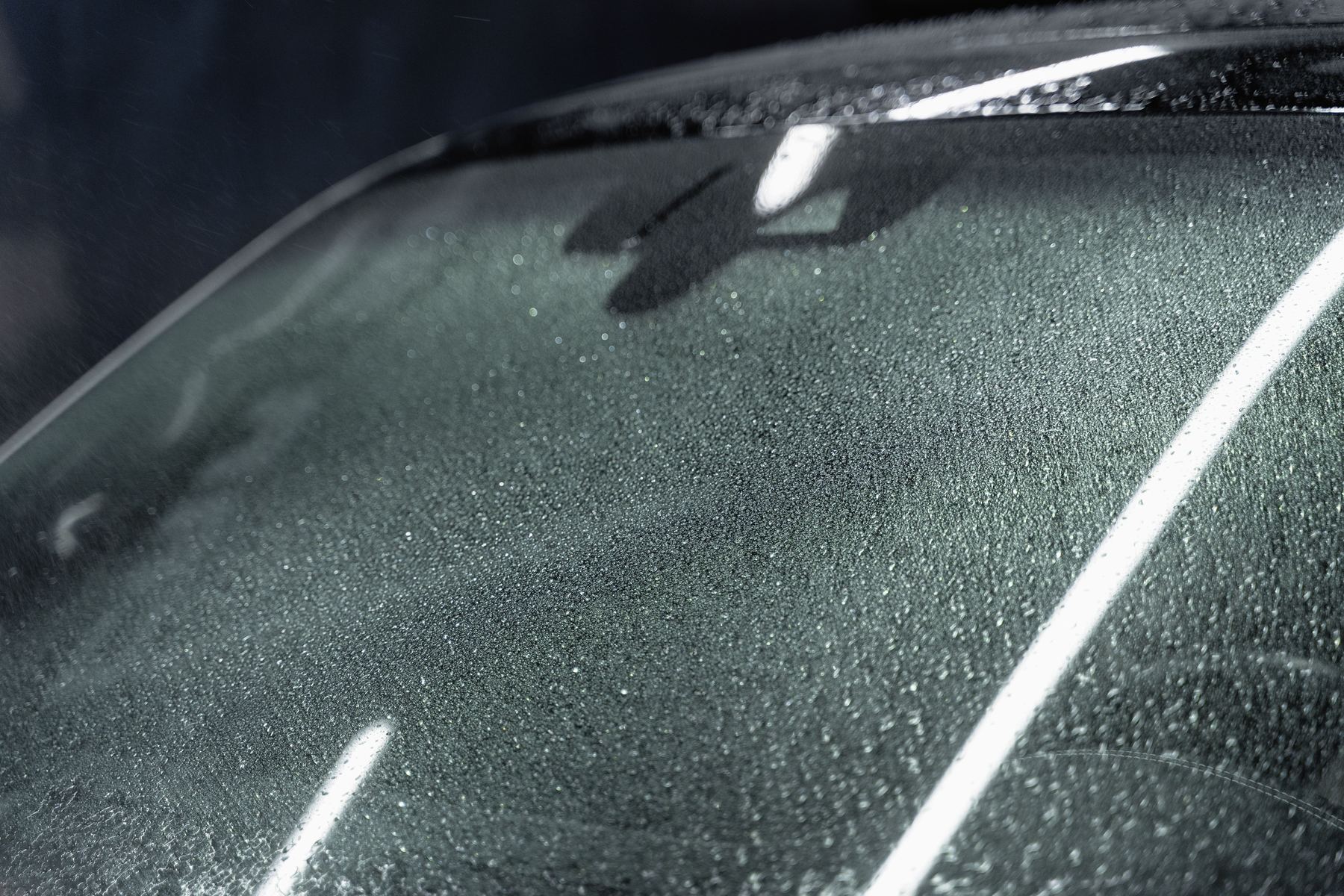 A car after a hailstorm, panels dimpled all over