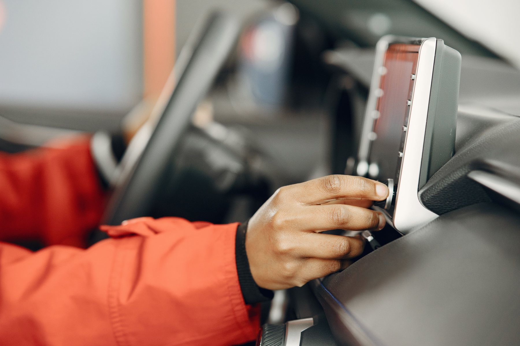 Working on a car panel by hand, close in on the repair