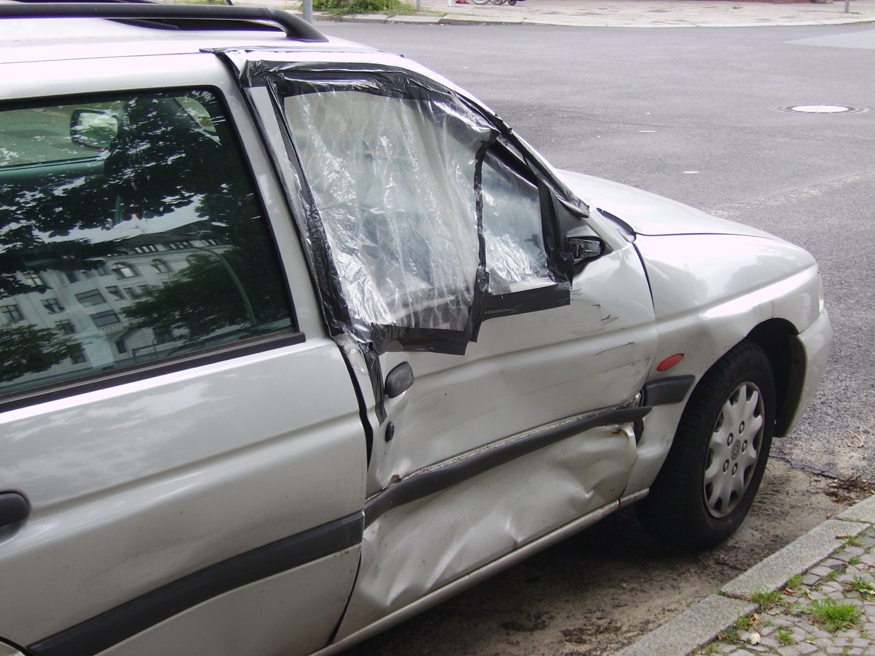 A dented car door panel
