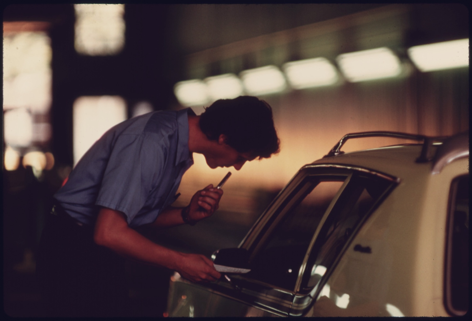 A technician running a diagnostic check on a vehicle