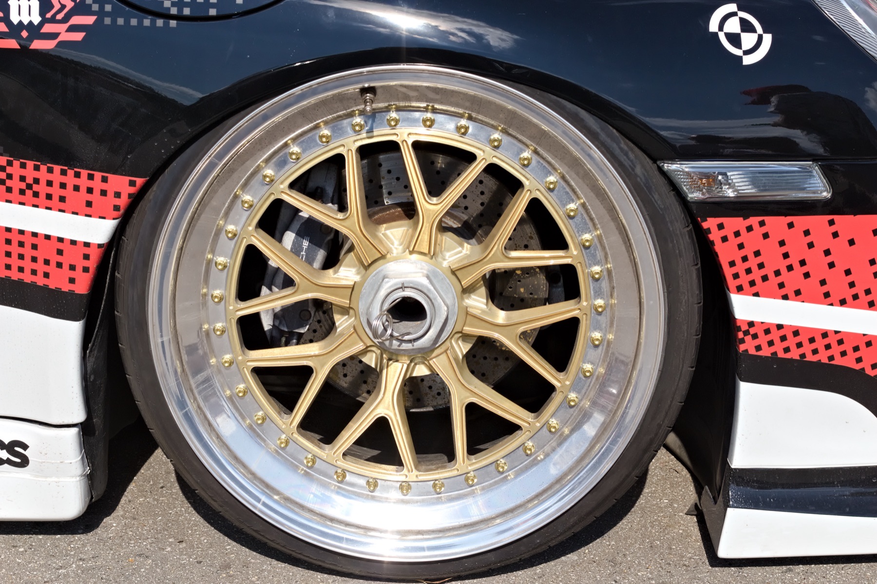 A multi-spoke alloy wheel, rim face in full view