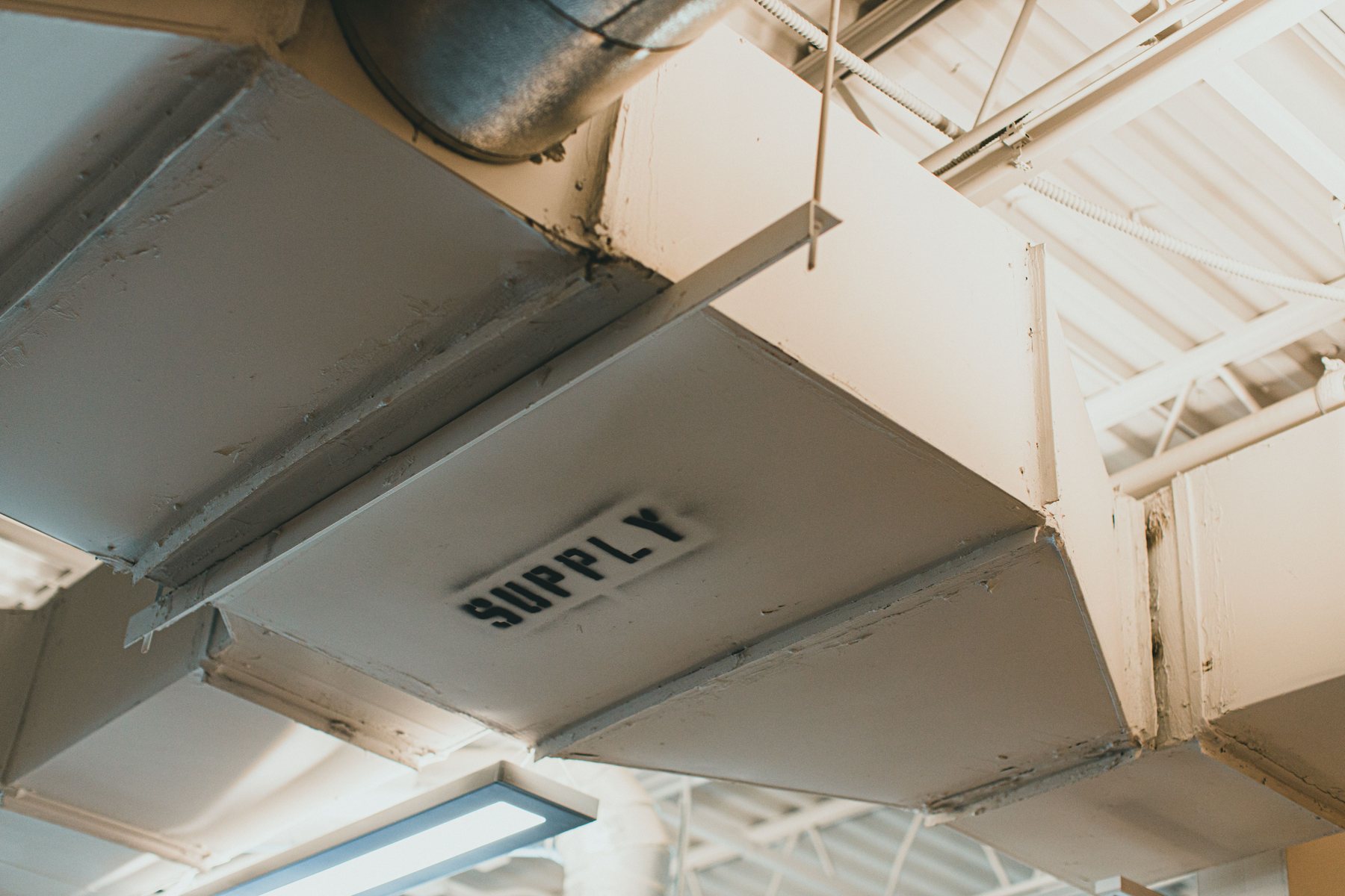 Runs of ducting overhead in a large building