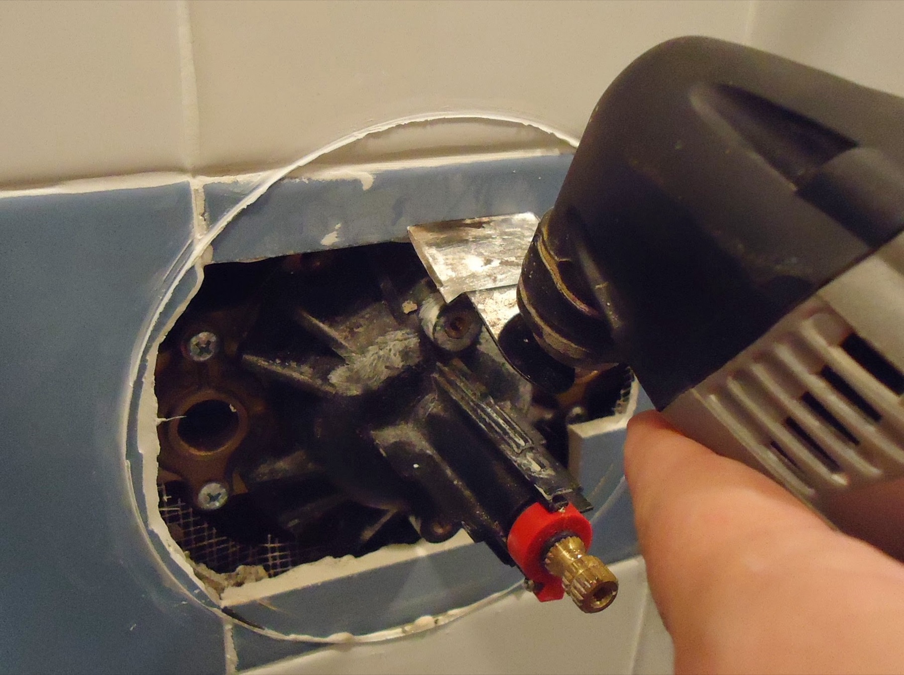 Hands replacing a valve cartridge