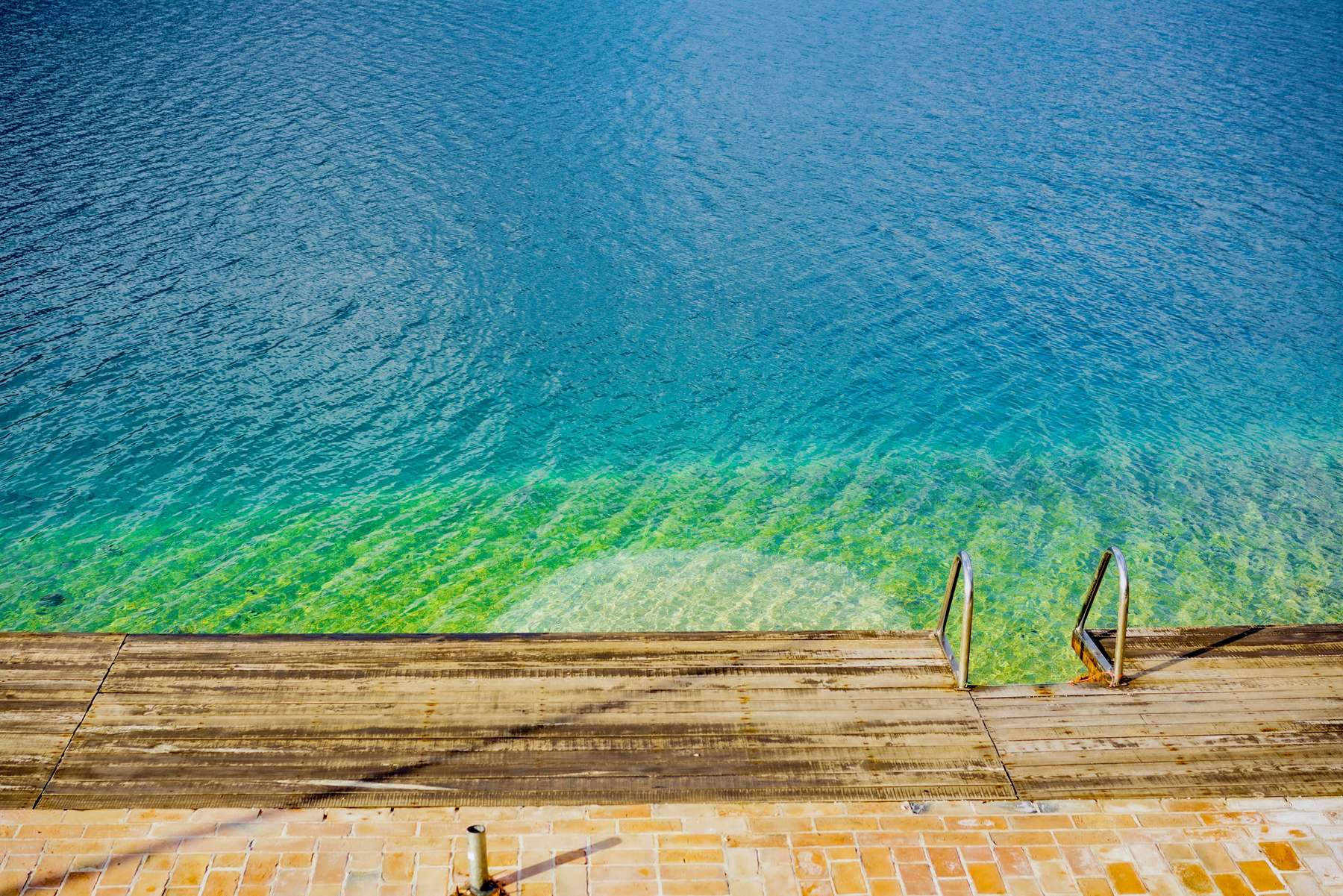 Pool decking running to the water's edge