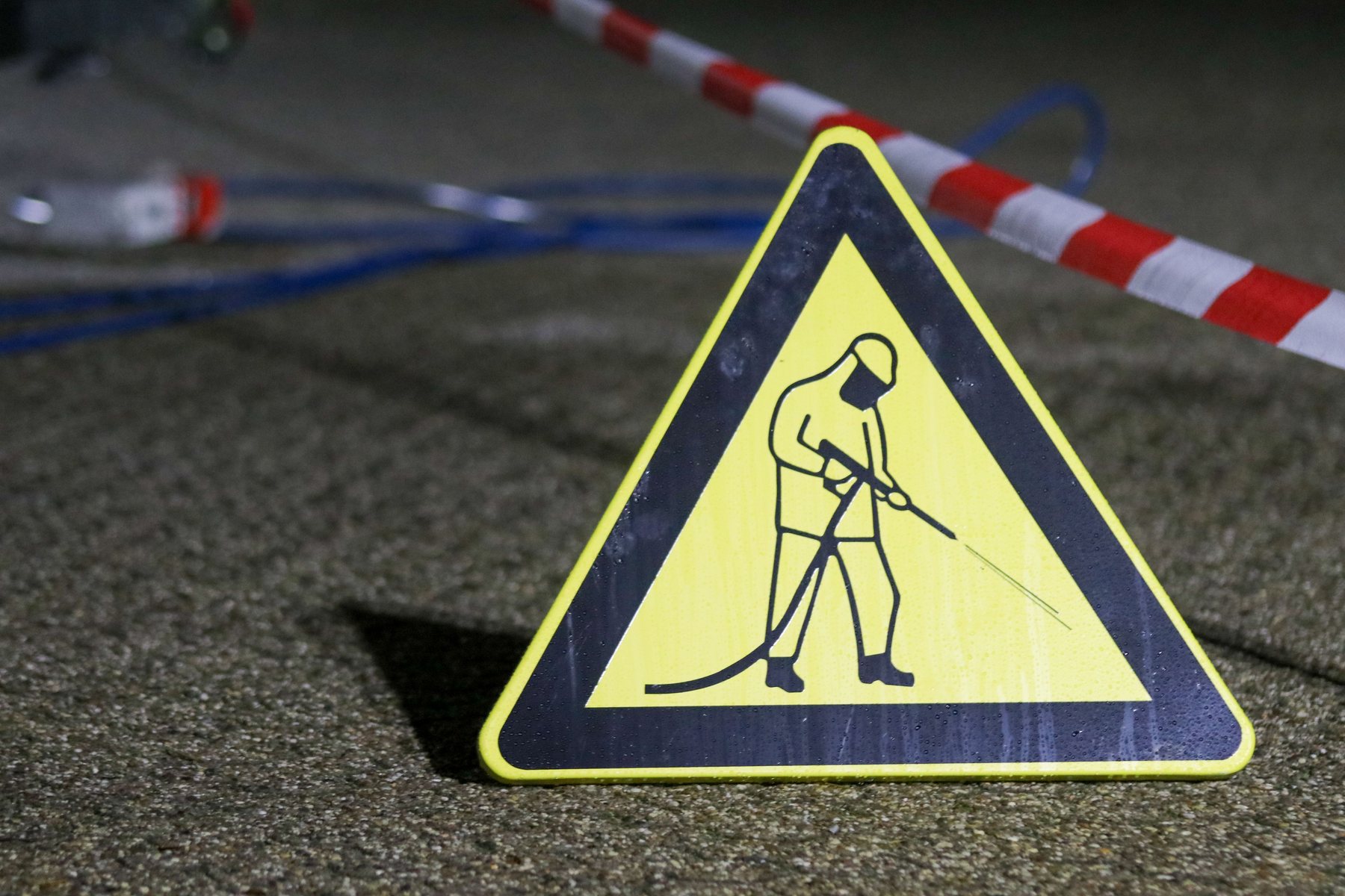 High-pressure cleaning across a commercial frontage