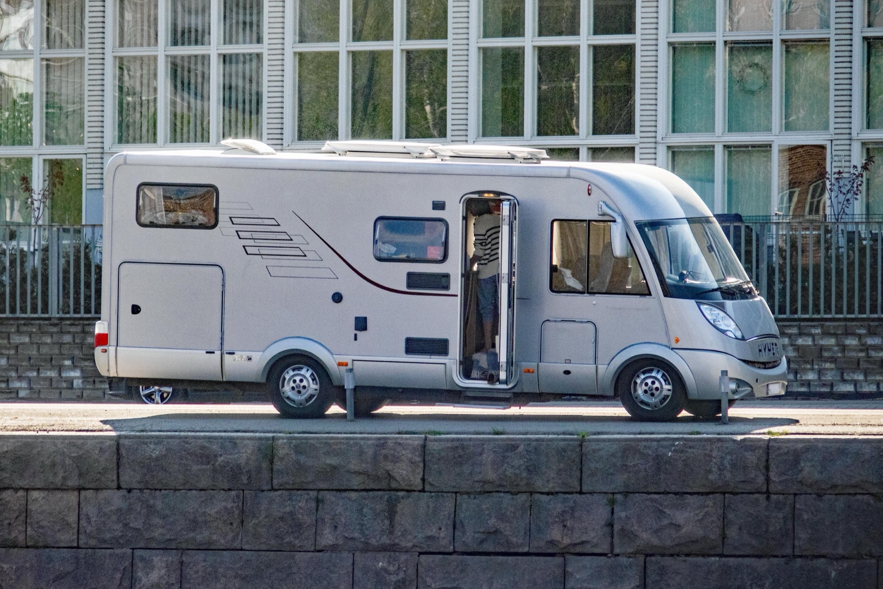 A motorhome parked beside a river