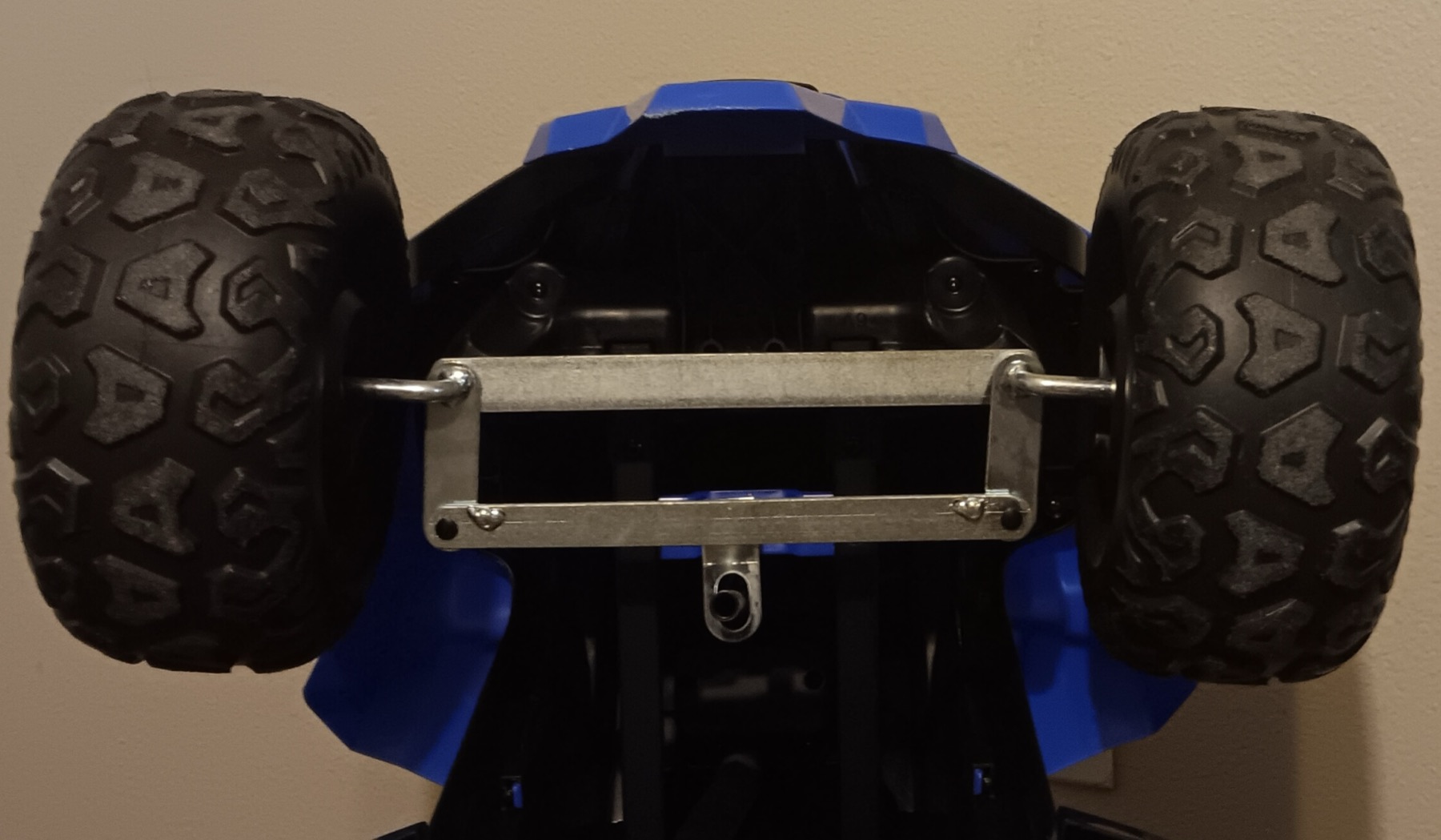 The wheels and steering of a small all-terrain vehicle
