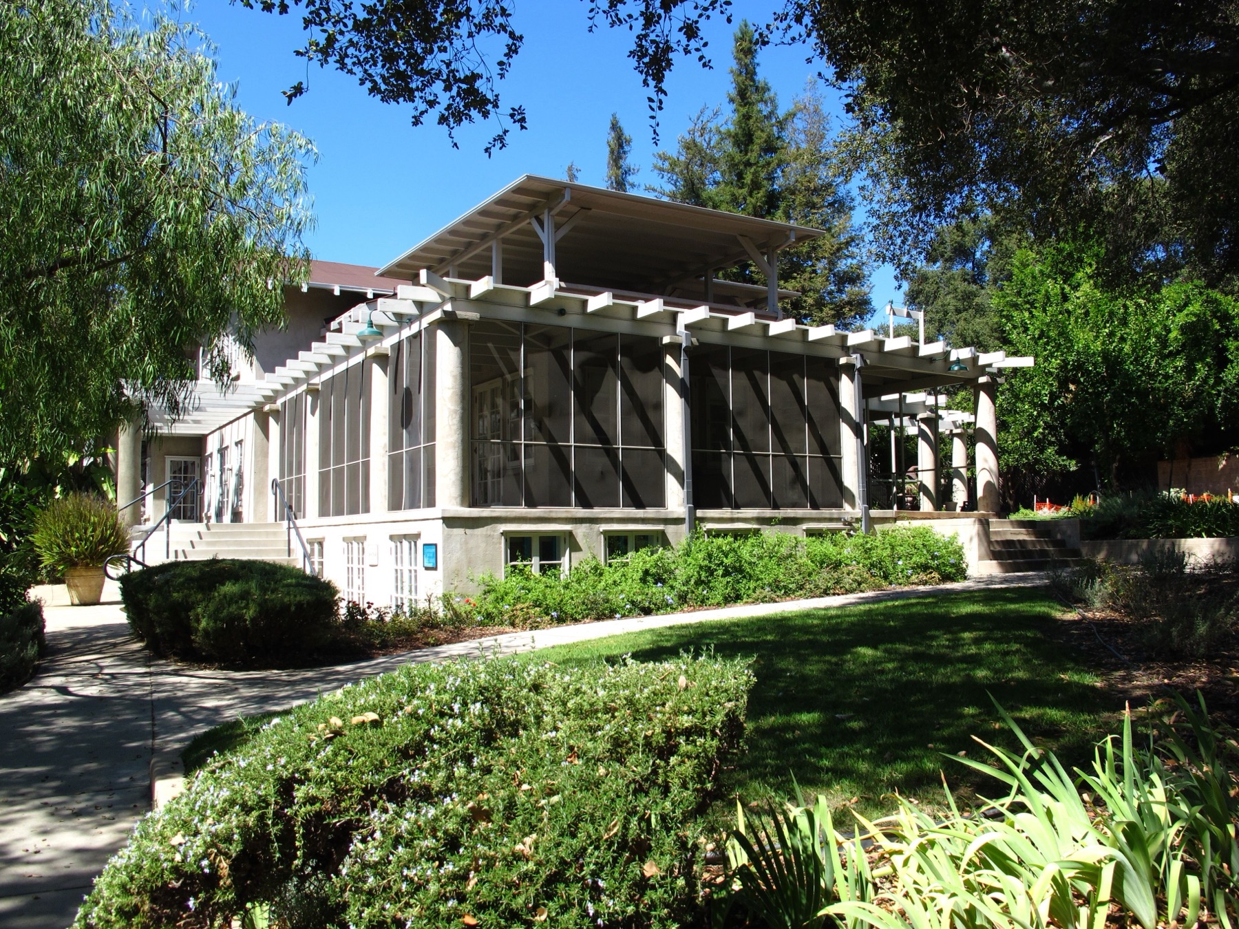 The screened porch running along the side of a house