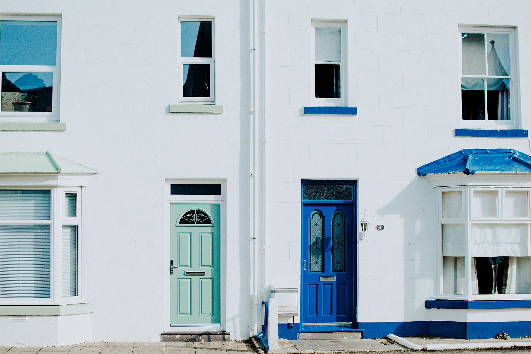 A screen door on the front of a house